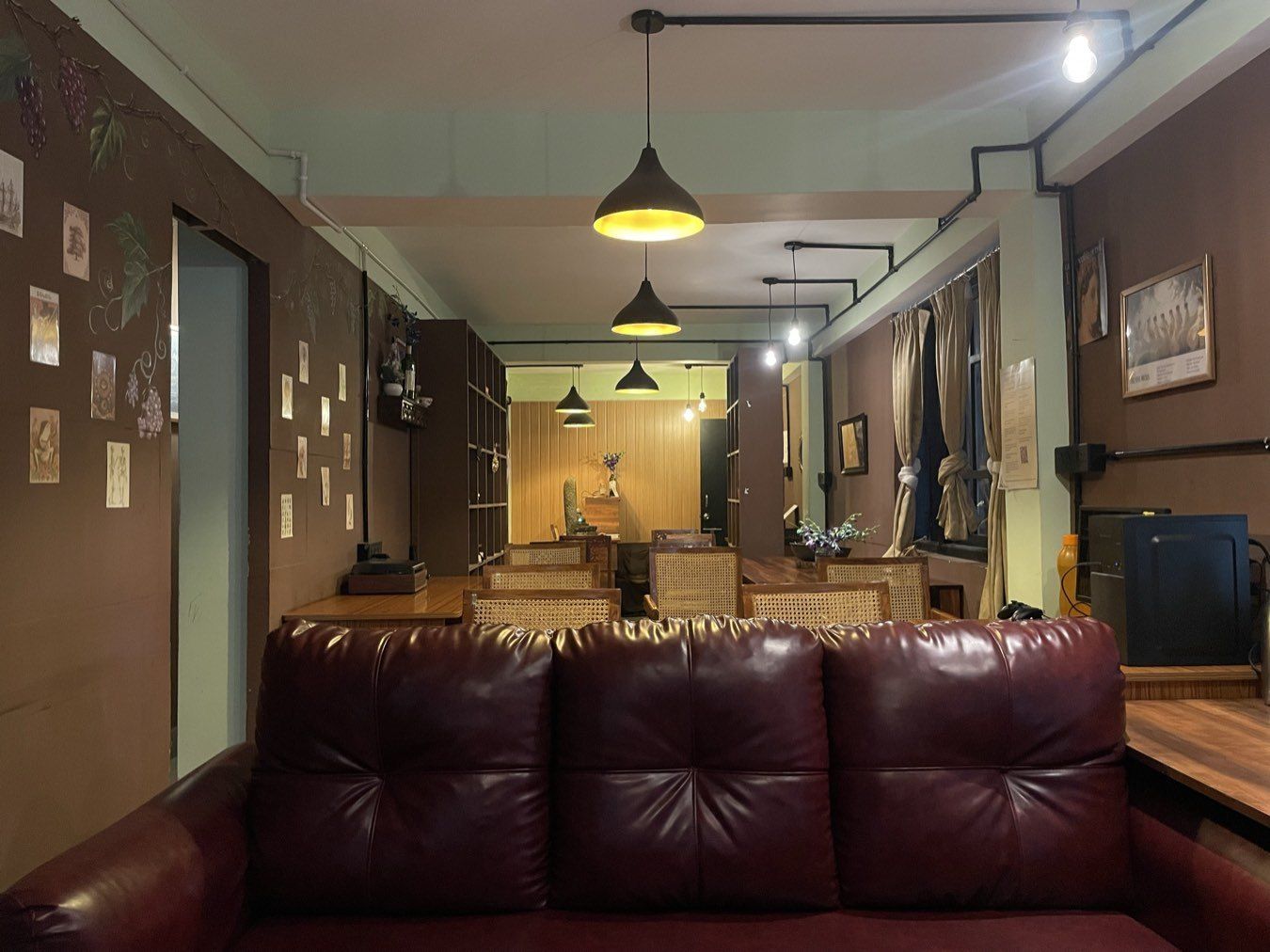 The Sanctorum coworking floor: lounge in front, desks and shelving behind